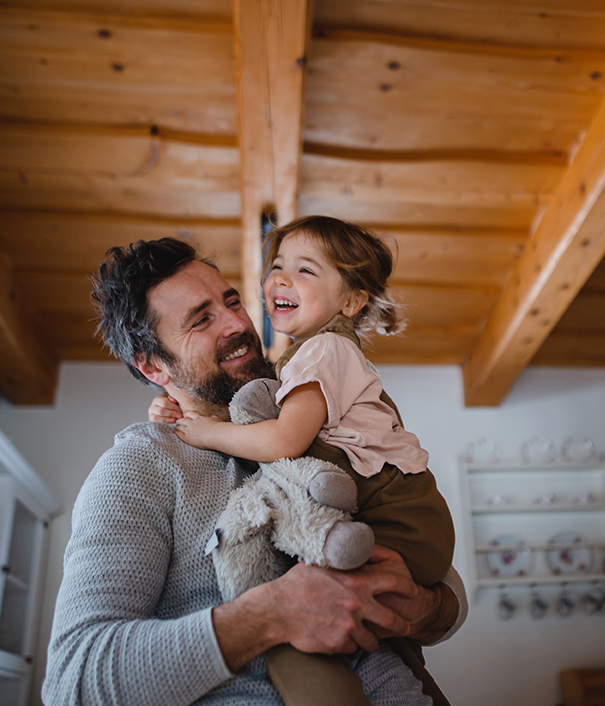 Happy father and daughter in their new home